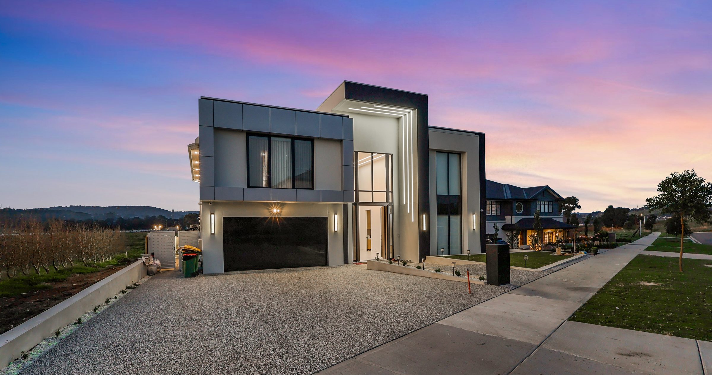 Twilight drone photograph of a modern two-storey Melbourne home, shot by Estate Lens Media