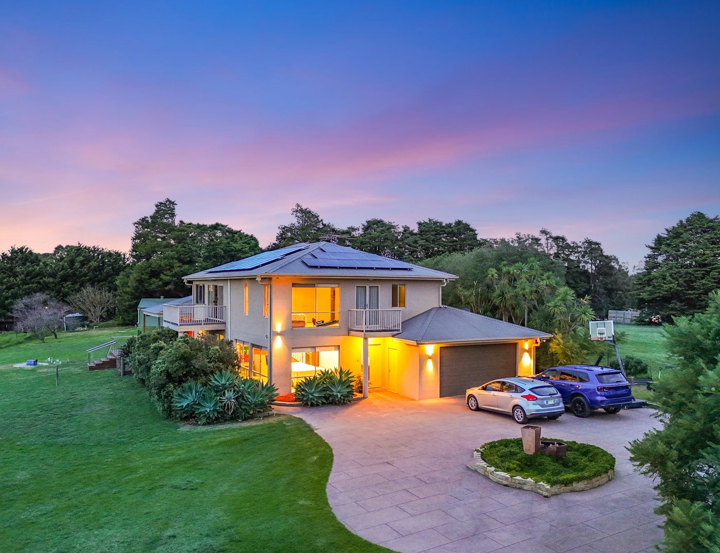 Final colour-graded drone edit of the same Melbourne property at twilight
