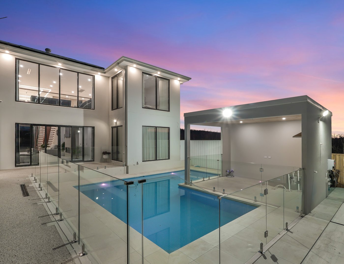 Final colour-graded edit of the same rear yard and pool at twilight