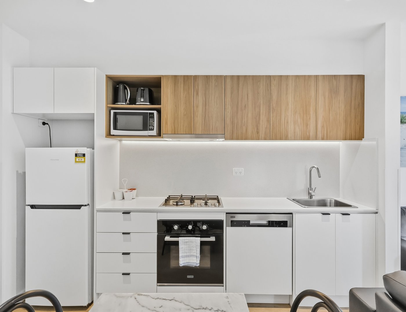 Final colour-graded edit of the same Melbourne apartment kitchen