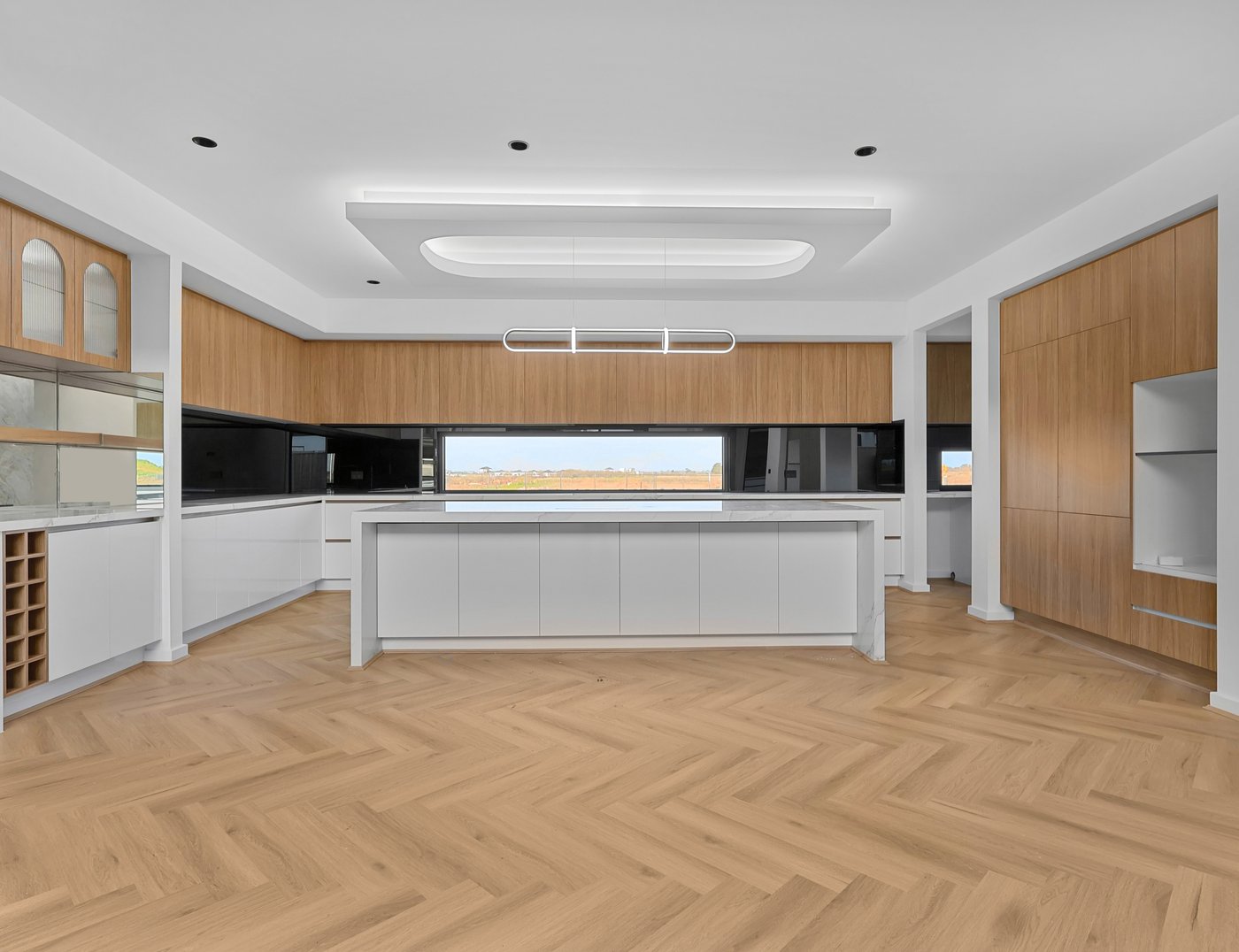 Final colour-graded edit of the same Melbourne home kitchen with herringbone flooring