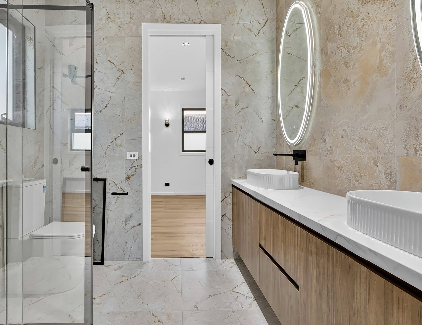 Final colour-graded edit of the same marble ensuite bathroom