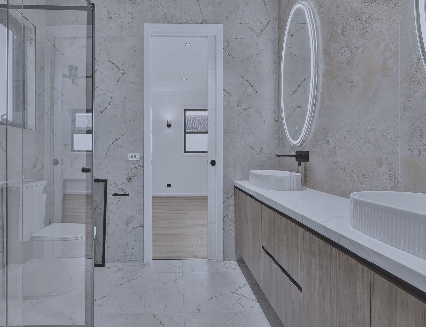 Unedited raw capture of a marble ensuite bathroom in a Melbourne home